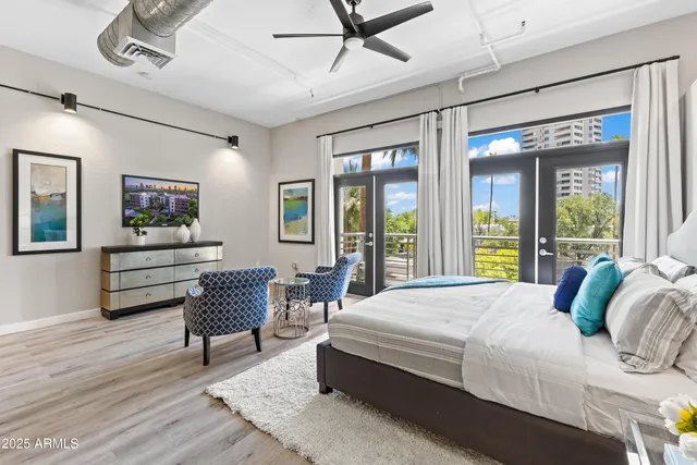 a view of a room with lots of wooden furniture