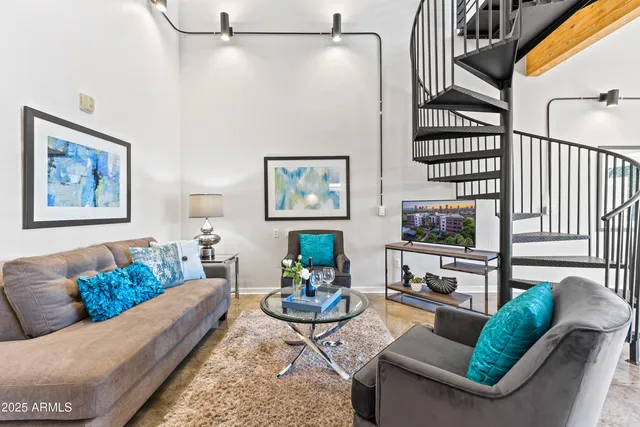 a table with chairs and a lamp on table