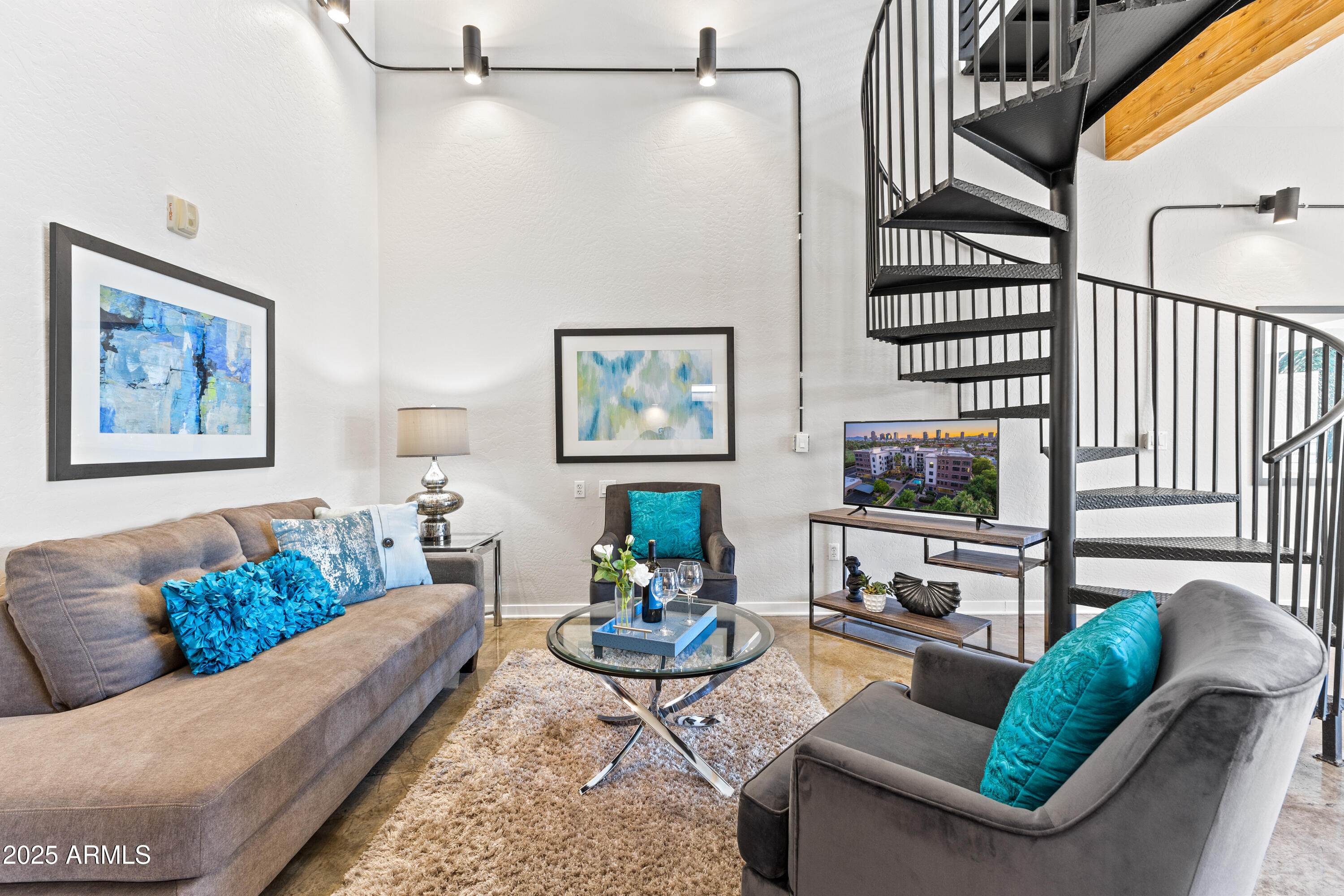 914 East Osborn Road, Unit 208 Phoenix, AZ 85014 - Photo 8 of 53 a living room with furniture and a flat screen tv
