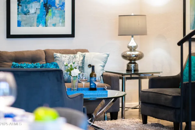 a front view of a house with outdoor seating