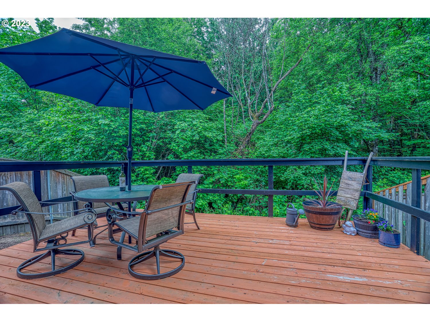 1407 Northeast 170th Circle Ridgefield, WA 98642 - Photo 38 of 42 a view of a deck with furniture and barbeque grill with wooden fence