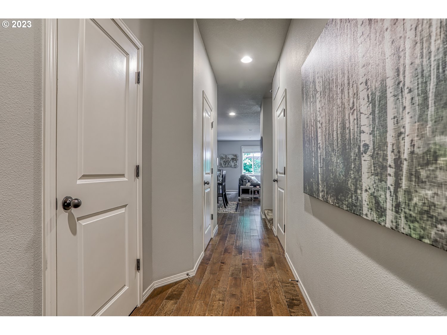 1407 Northeast 170th Circle Ridgefield, WA 98642 - Photo 5 of 42 a view of a hallway with wooden floor