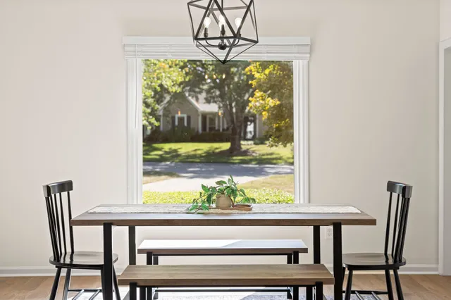 a view of a dining room with furniture window and outside view