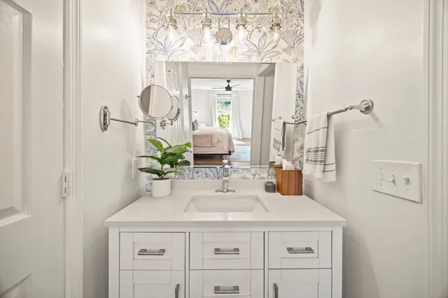 a bathroom with a sink and a mirror