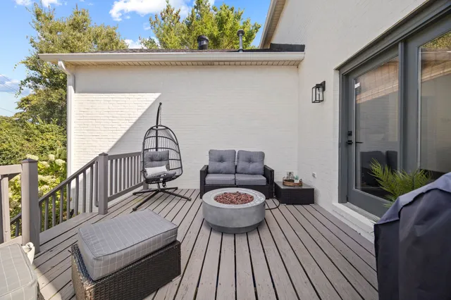 a view of a two chairs in the balcony