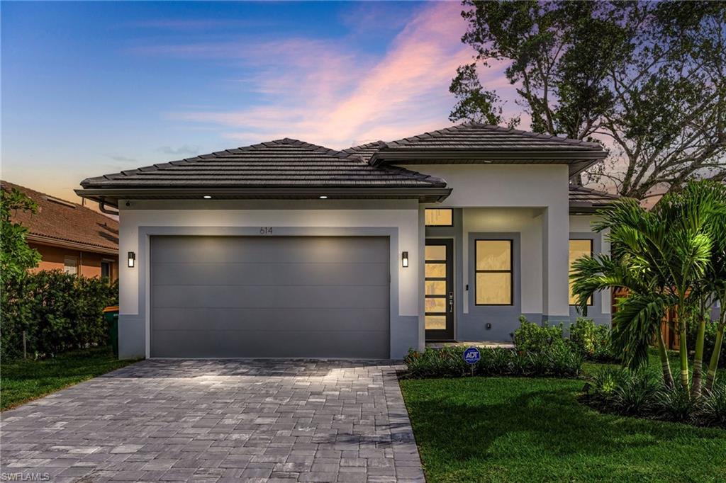 614 105th Avenue North Naples, FL 34108 - Photo 1 of 37 a view of a house with a small yard