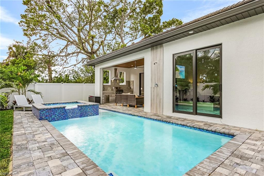 614 105th Avenue North Naples, FL 34108 - Photo 2 of 37 a view of swimming pool with patio