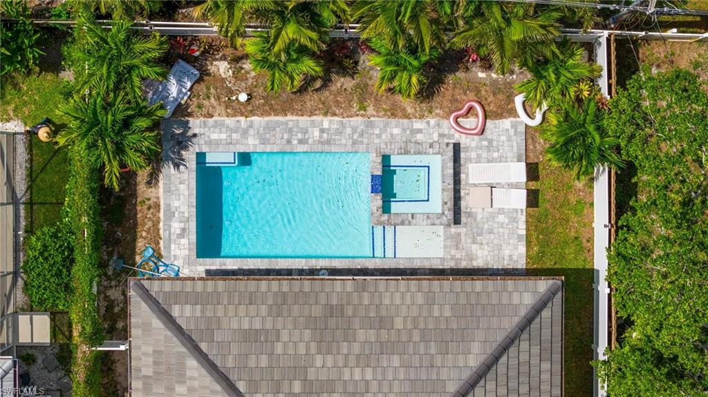 614 105th Avenue North Naples, FL 34108 - Photo 30 of 37 a sign that is on the side of a building