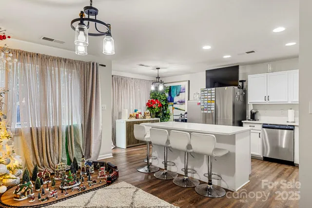 a kitchen with microwave a stove and refrigerator