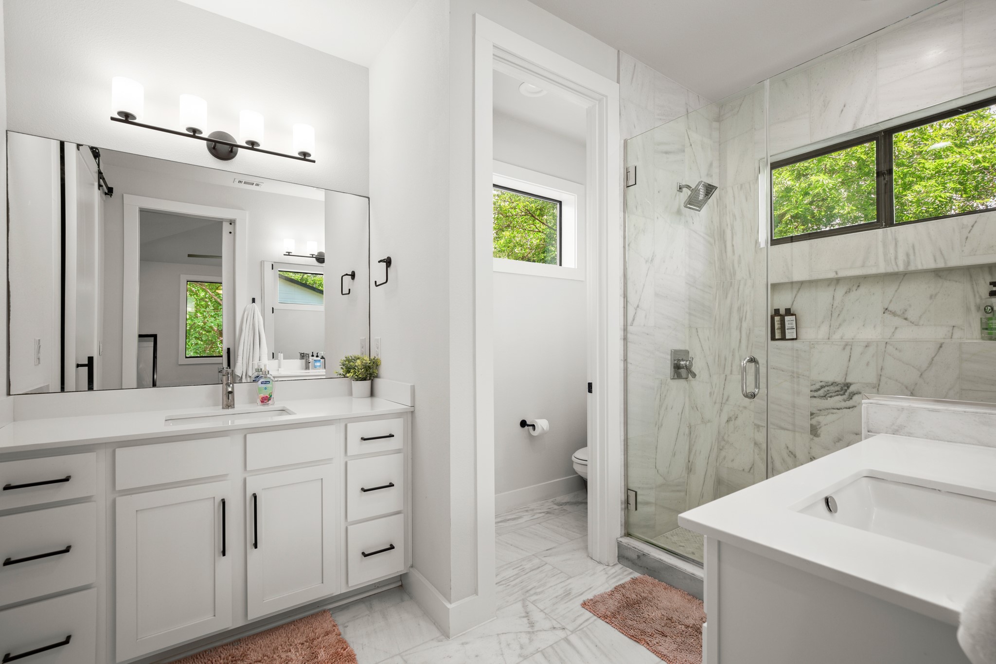 611 Gaylor Street, Unit 2 Austin, TX 78752 - Photo 12 of 31 Bathroom featuring marble look tile flooring, vanity, and a marble finish shower