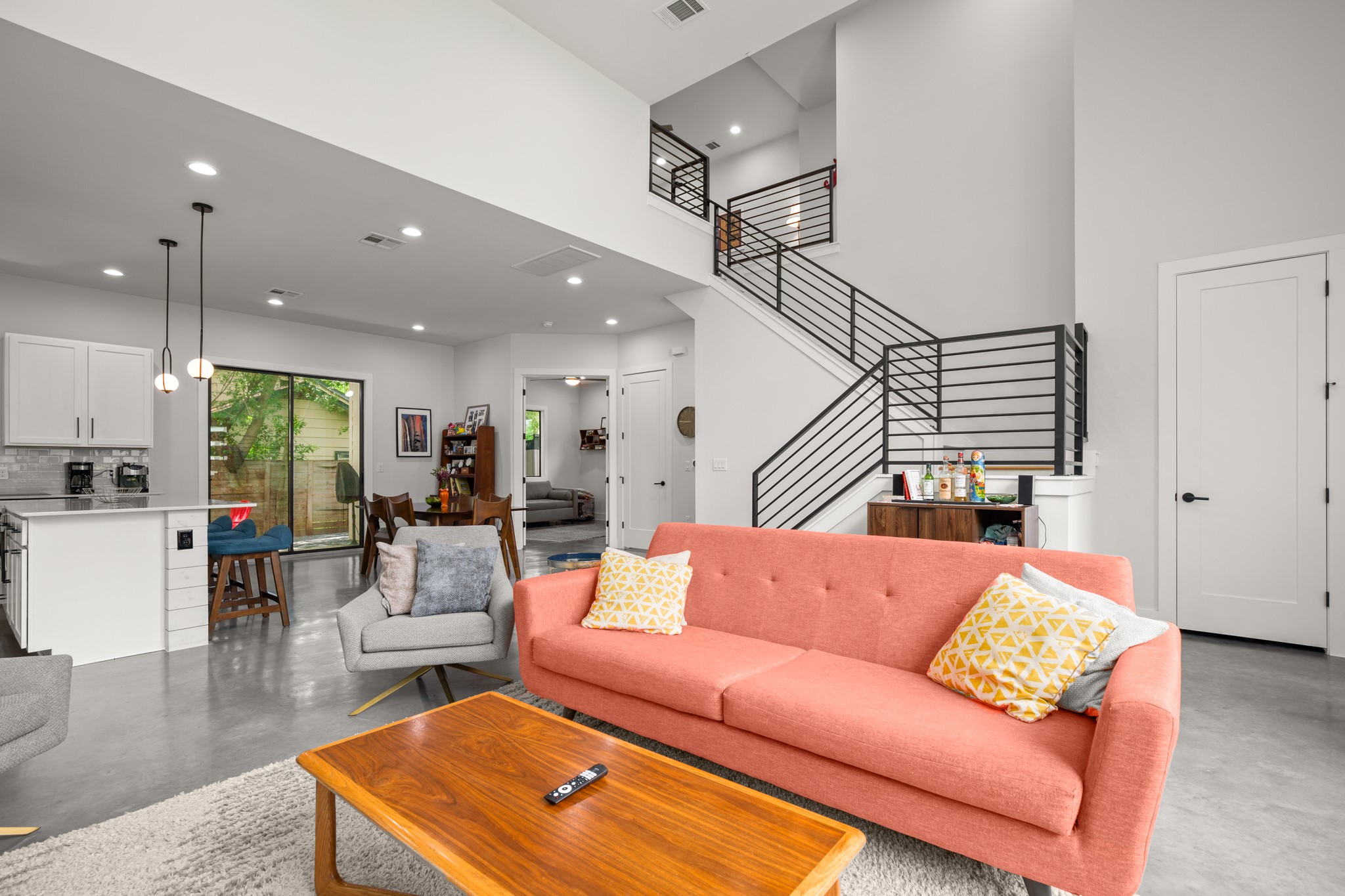 611 Gaylor Street, Unit 2 Austin, TX 78752 - Photo 14 of 31 Living area with concrete flooring, stairway, recessed lighting, and a high ceiling