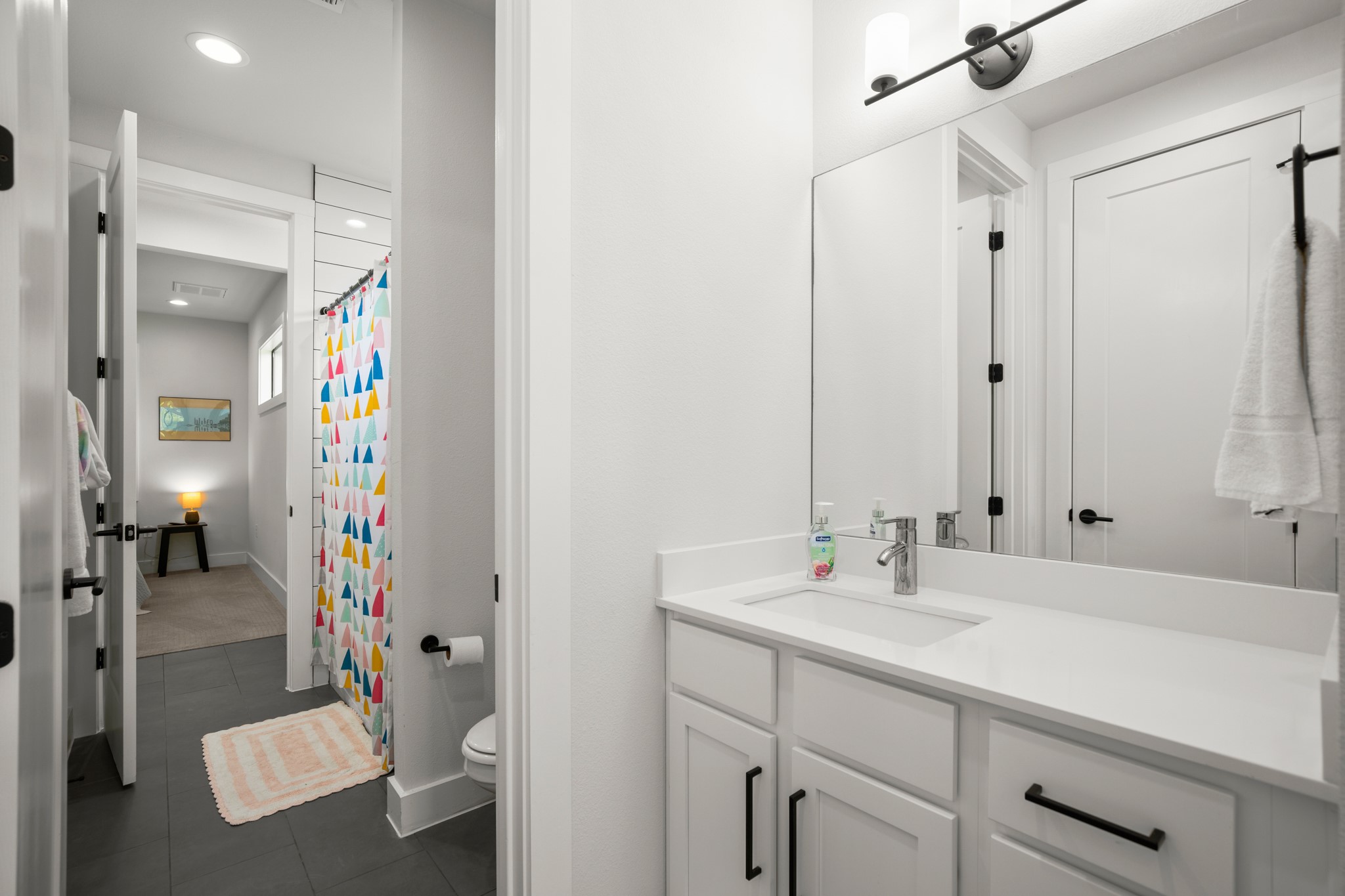 611 Gaylor Street, Unit 2 Austin, TX 78752 - Photo 26 of 31 Bathroom featuring vanity, tile patterned floors, recessed lighting, and a shower with curtain