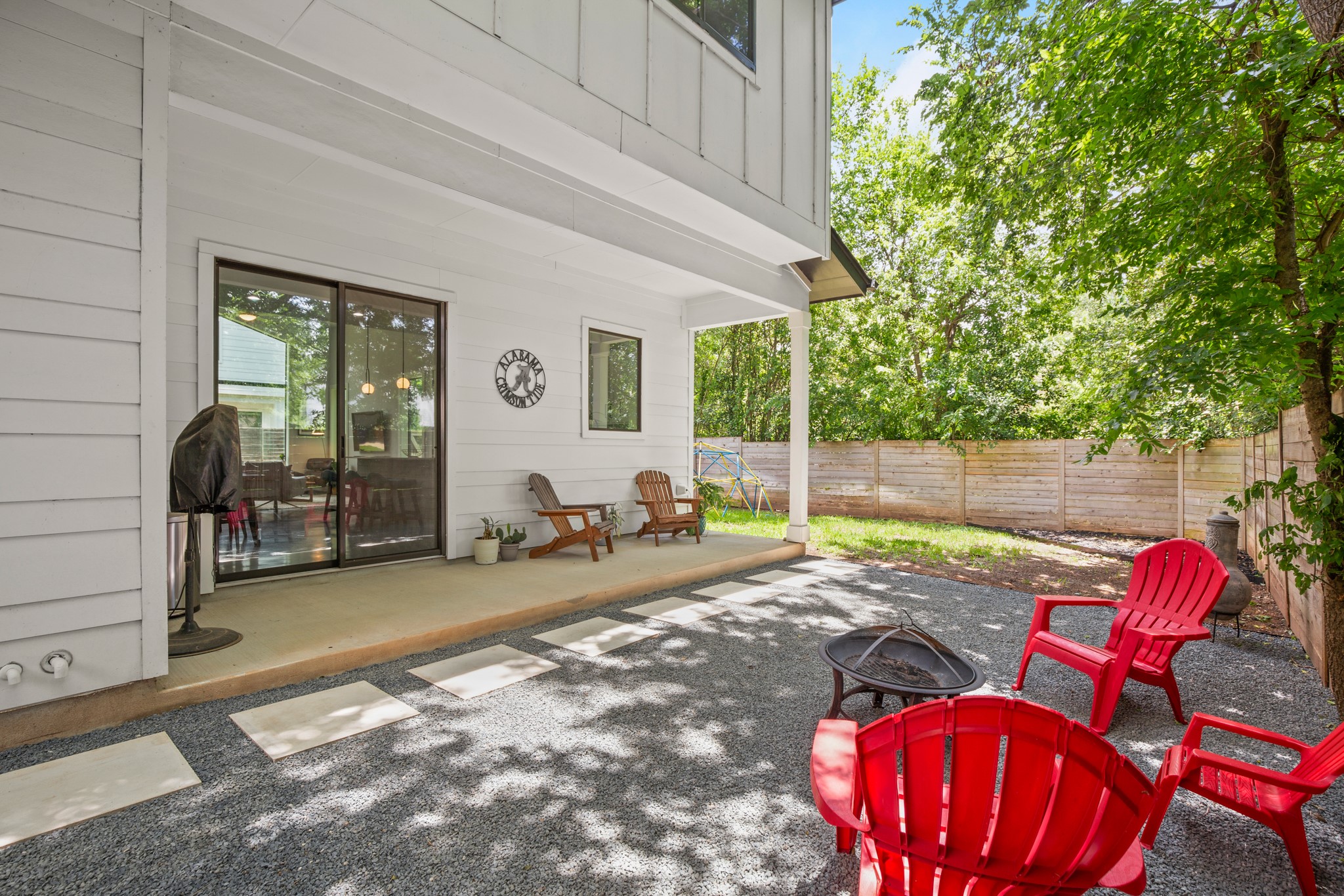 611 Gaylor Street, Unit 2 Austin, TX 78752 - Photo 29 of 31 Fenced backyard featuring a fire pit and a patio area