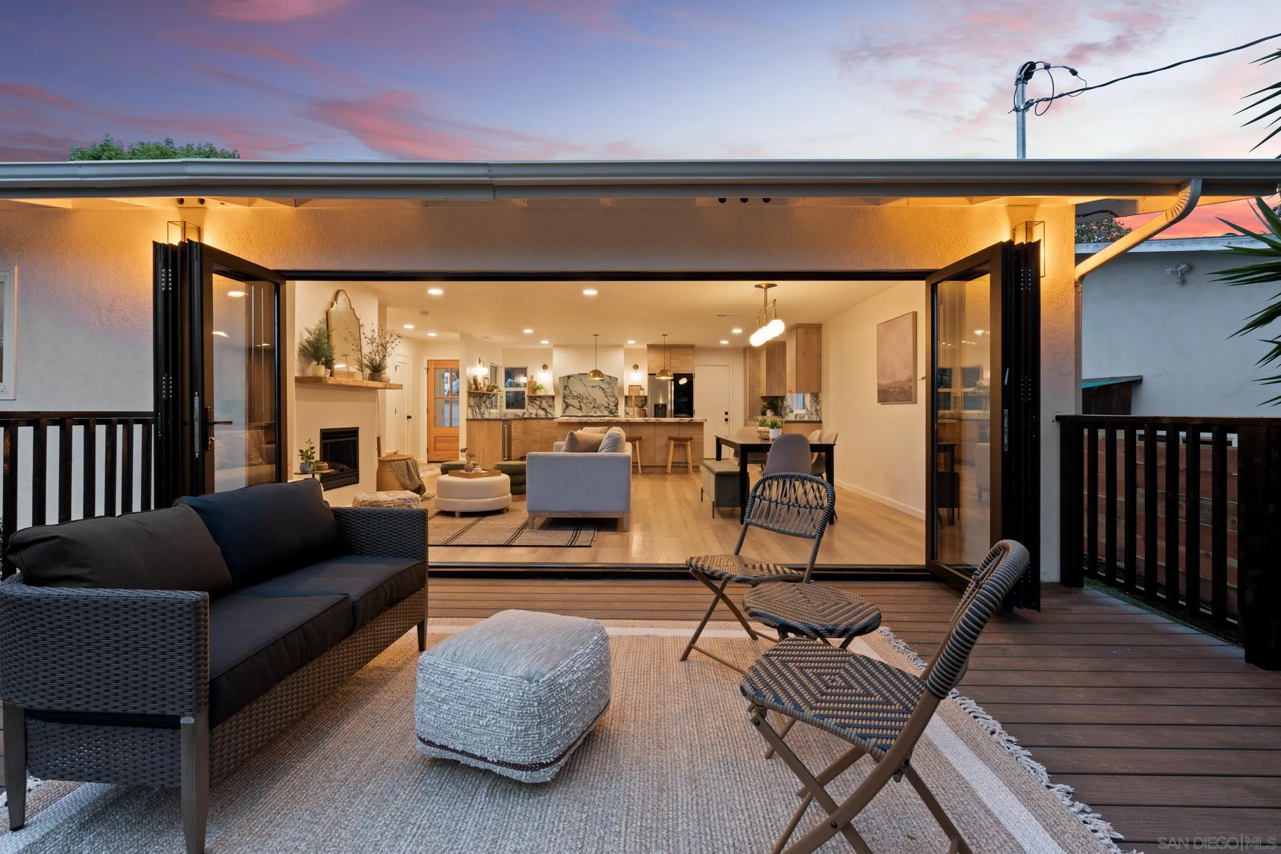 1144 Stratford Drive Encinitas, CA 92024 - Photo 25 of 39 a living room with furniture a rug and a large window