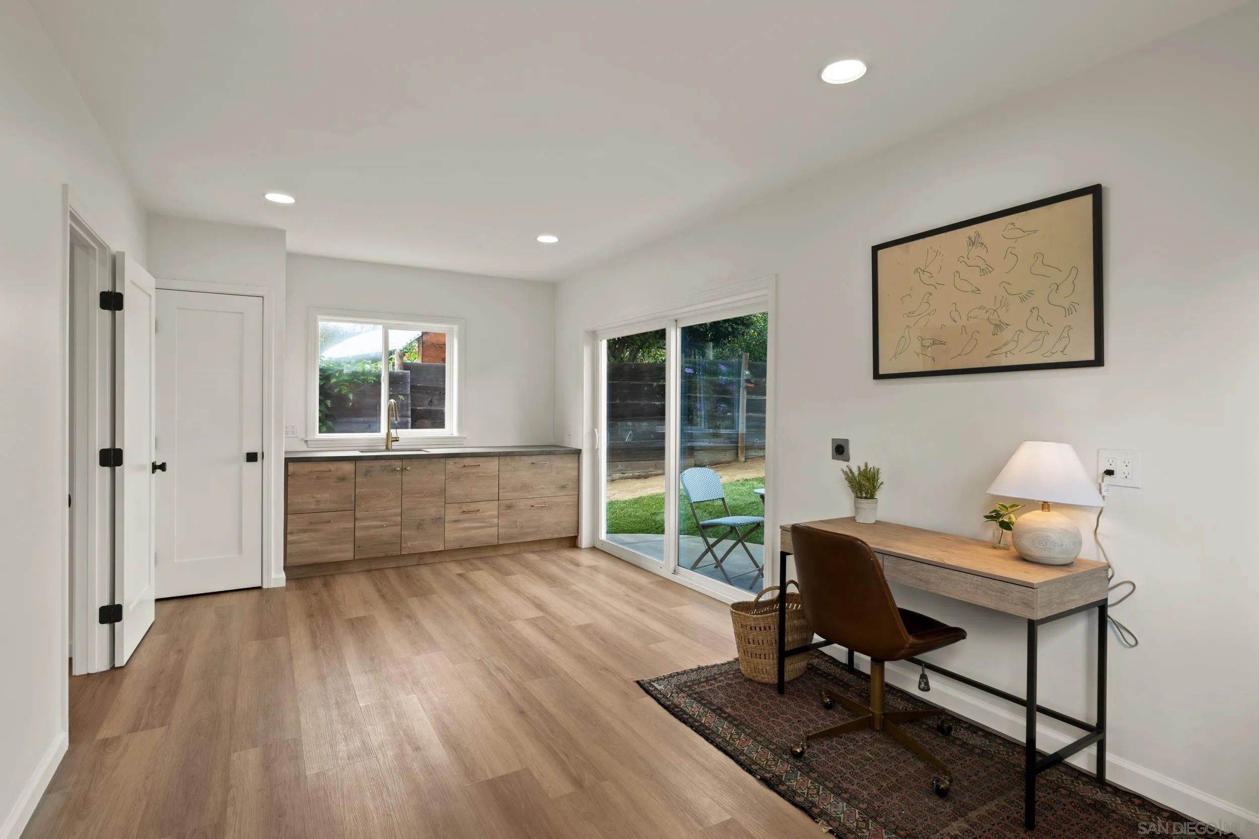 1144 Stratford Drive Encinitas, CA 92024 - Photo 30 of 39 a view of a workspace with furniture and a window