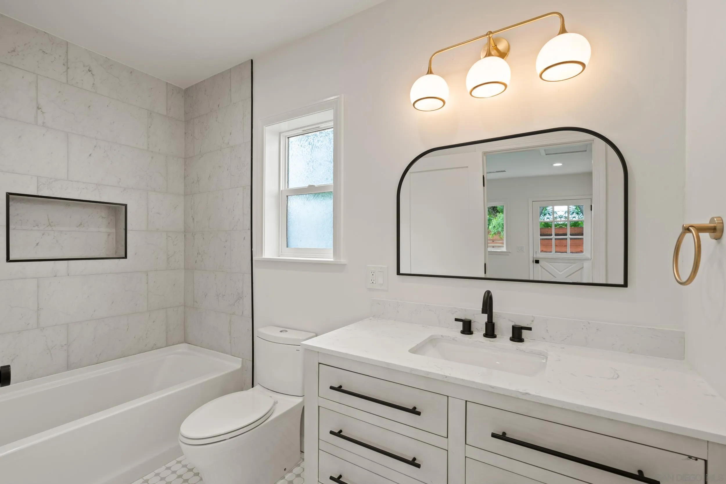 1144 Stratford Drive Encinitas, CA 92024 - Photo 33 of 39 a bathroom with a sink a toilet and a bathtub