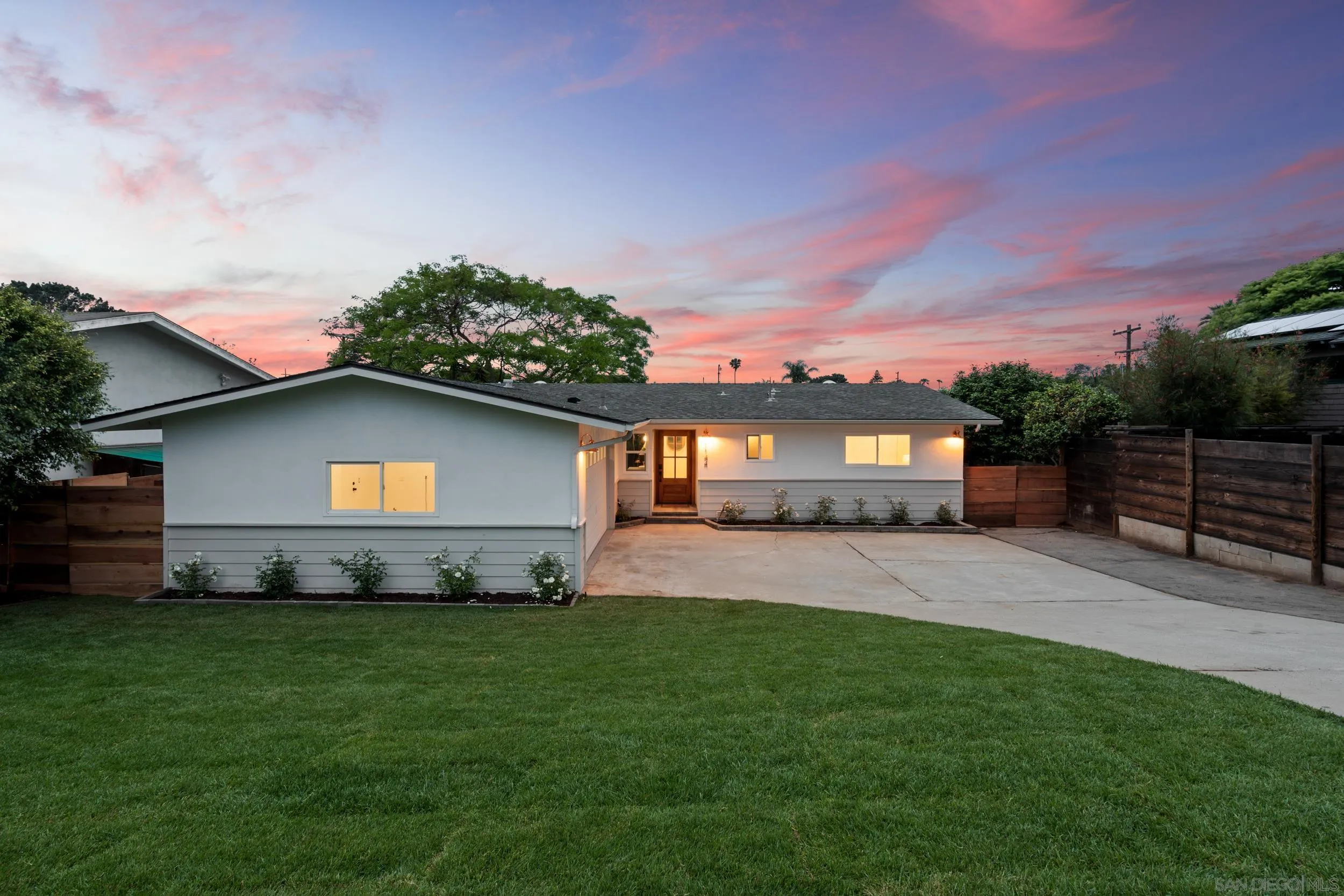 1144 Stratford Drive Encinitas, CA 92024 - Photo 39 of 39 a front view of a house with a garden and yard