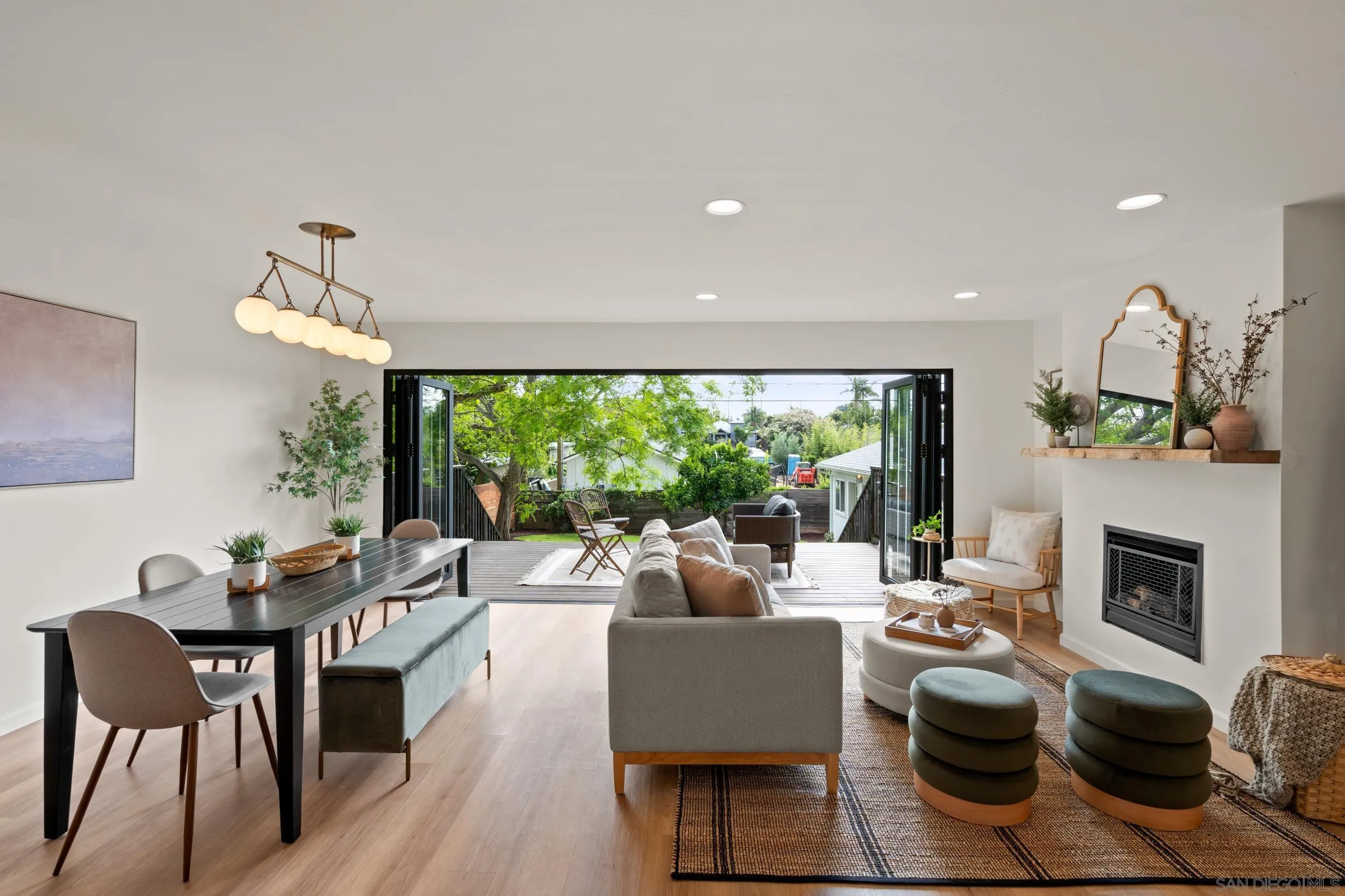 1144 Stratford Drive Encinitas, CA 92024 - Photo 4 of 39 a living room with fireplace furniture and a large window