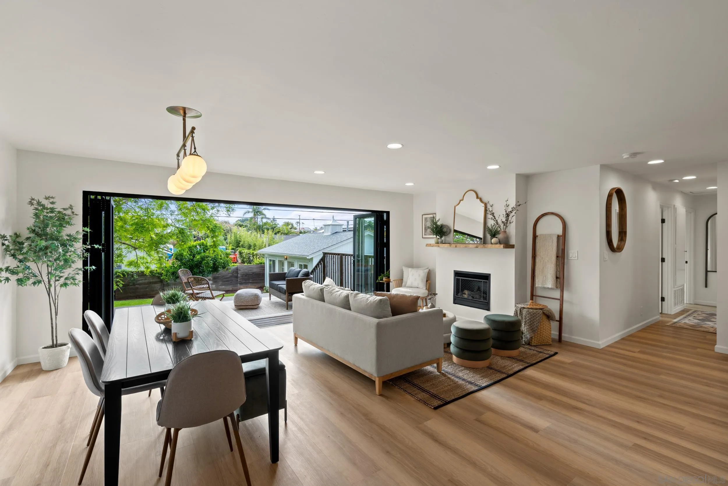 1144 Stratford Drive Encinitas, CA 92024 - Photo 5 of 39 a living room with fireplace furniture and a large window