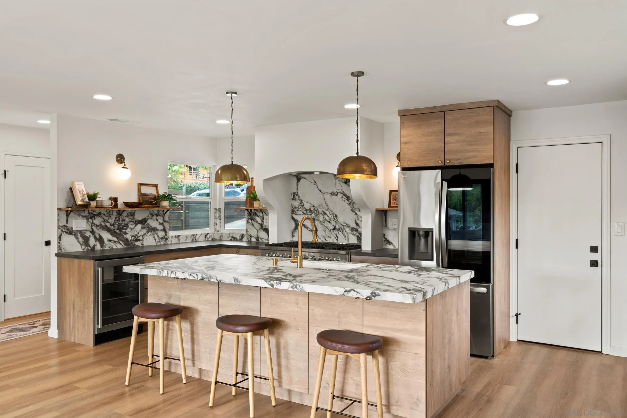 1144 Stratford Drive Encinitas, CA 92024 - Photo 7 of 39 a kitchen with a table and chairs in it