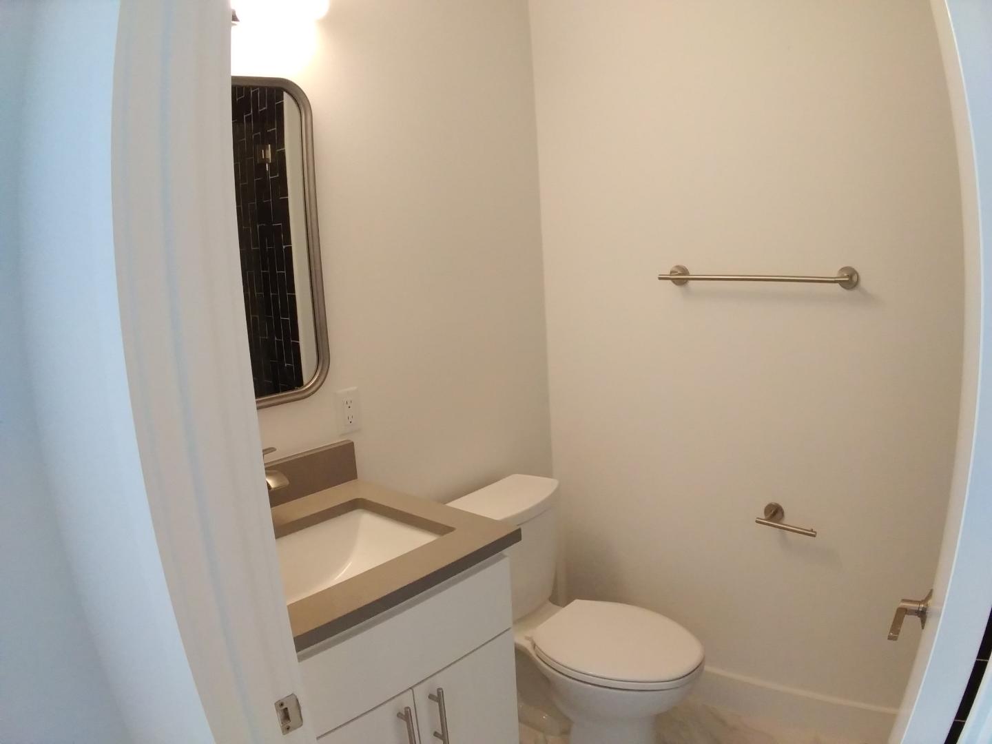 7309 Bennett Avenue, Unit B Austin, TX 78752 - Photo 5 of 16 Bathroom featuring vanity and toilet