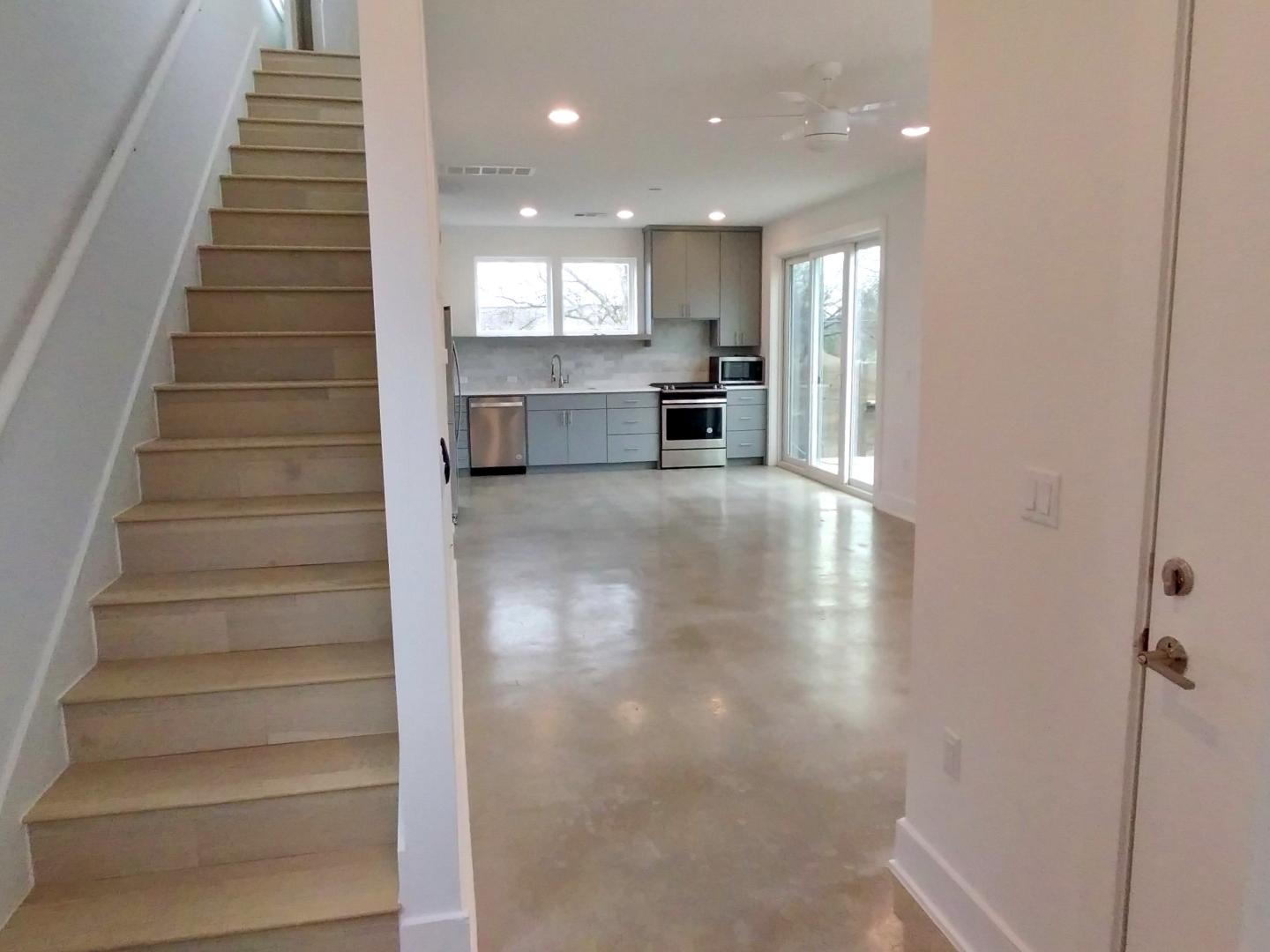 7309 Bennett Avenue, Unit B Austin, TX 78752 - Photo 6 of 16 Staircase featuring concrete flooring and recessed lighting