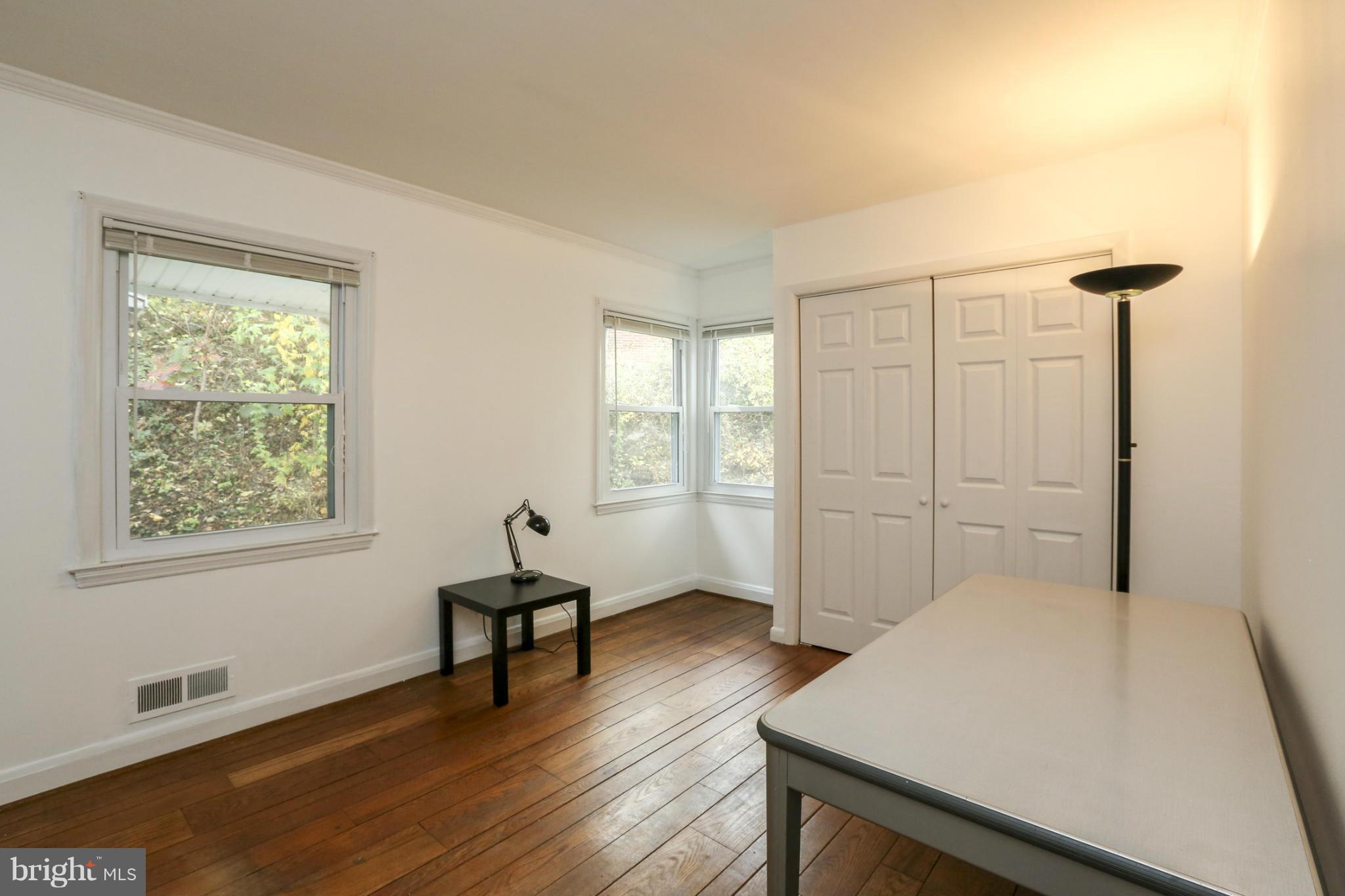6730 Queens Ferry Road Baltimore, MD 21239 - Photo 12 of 21 a bedroom with furniture and window