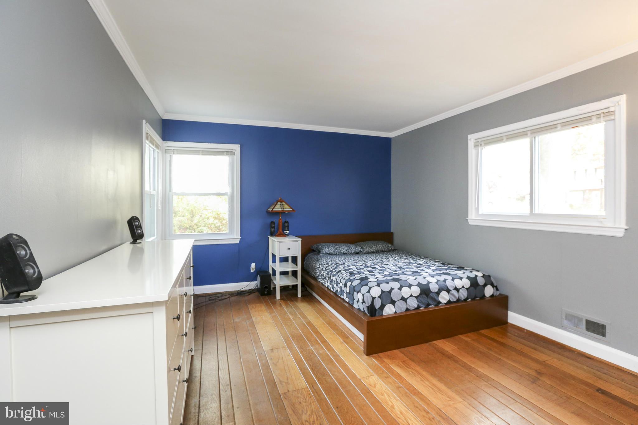 6730 Queens Ferry Road Baltimore, MD 21239 - Photo 14 of 21 a bedroom with a bed and a window
