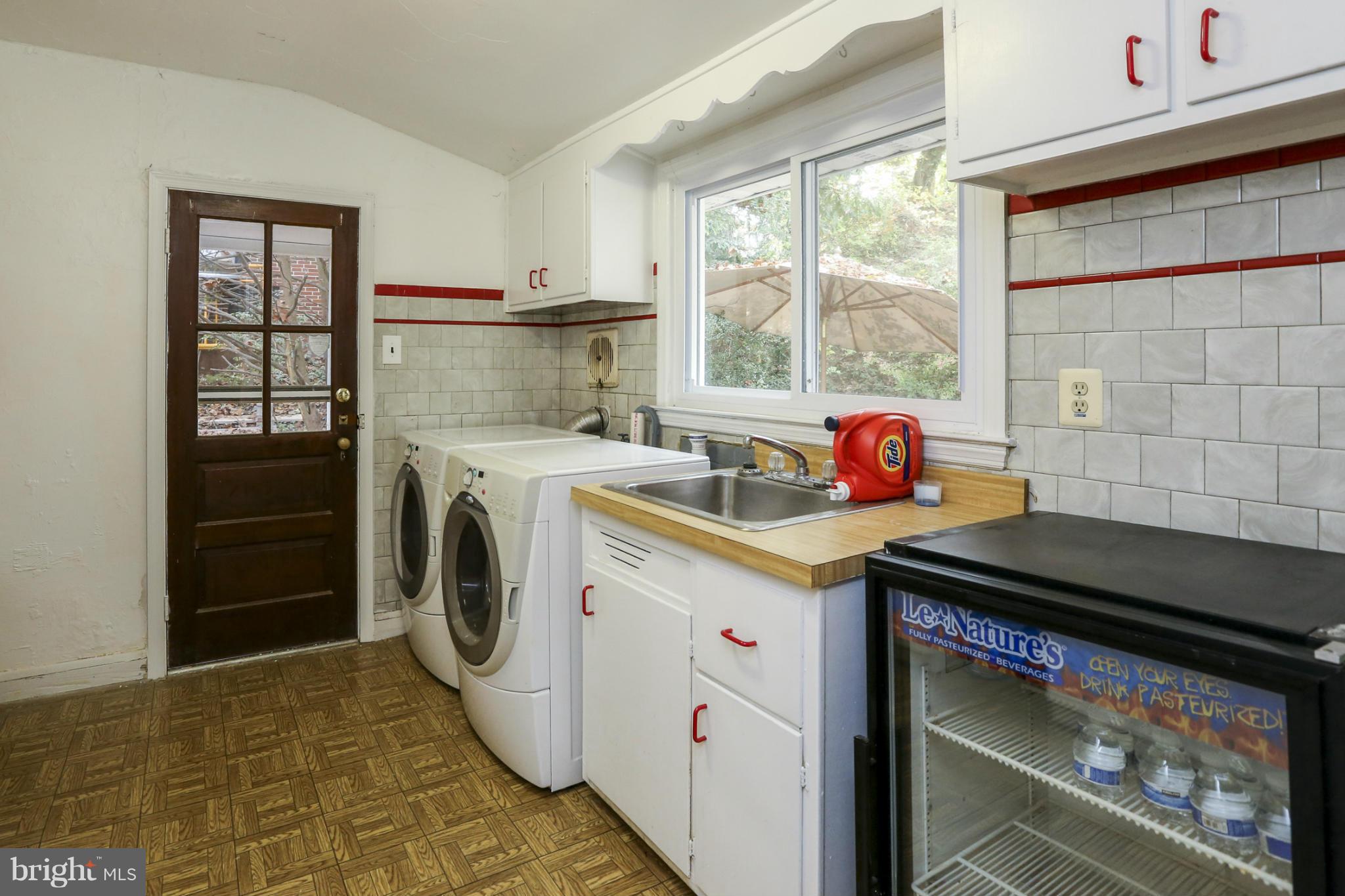 6730 Queens Ferry Road Baltimore, MD 21239 - Photo 16 of 21 a utility room with dryer and washer