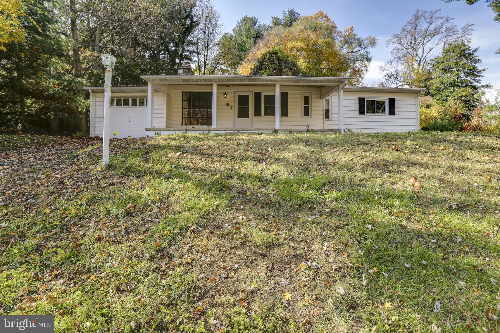 6730 Queens Ferry Road Baltimore, MD 21239 - Photo 3 of 21 front view of house with a yard