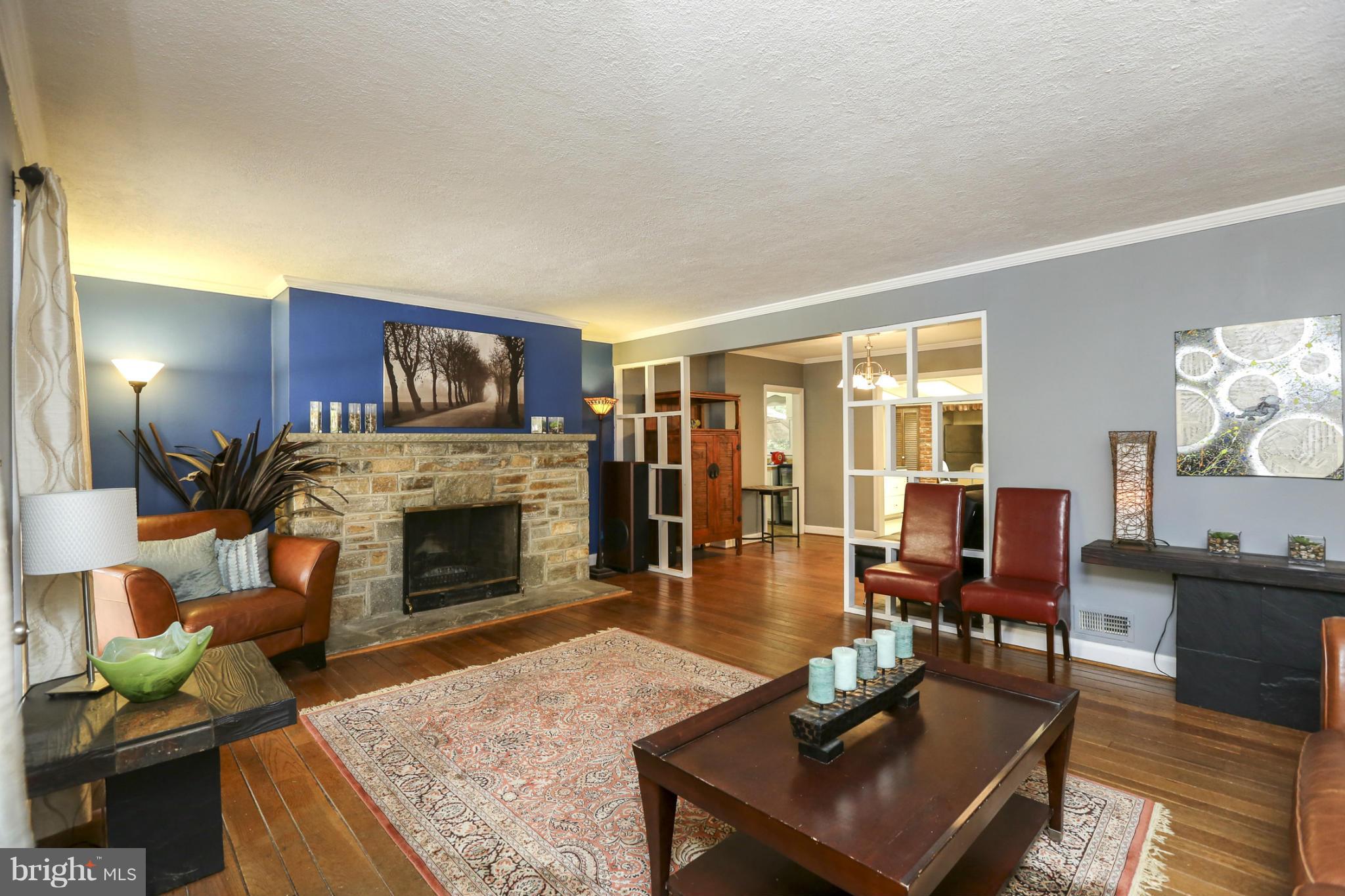 6730 Queens Ferry Road Baltimore, MD 21239 - Photo 5 of 21 a living room with furniture fireplace and dining table