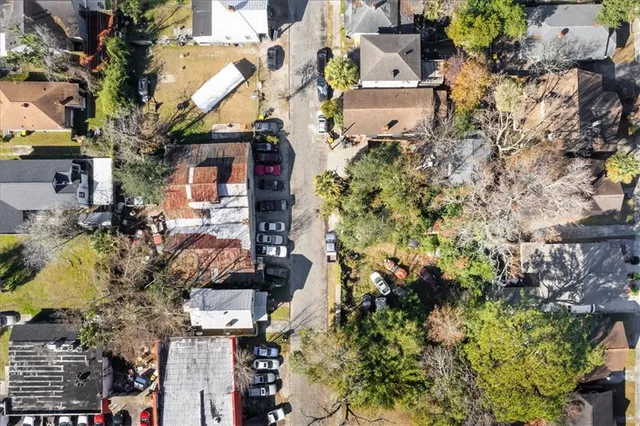 an aerial view of residential houses with outdoor space