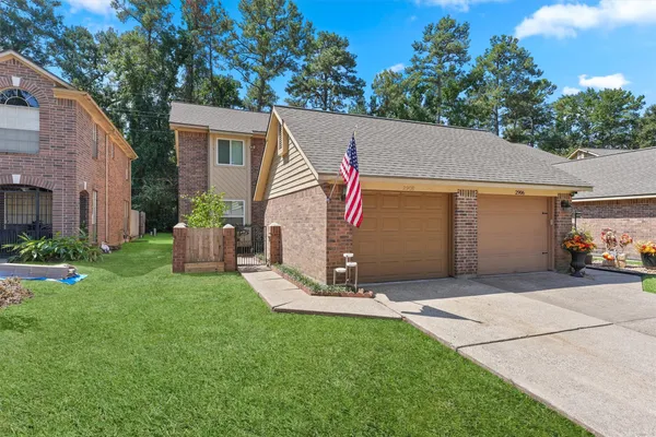 a view of an house with backyard space and garden