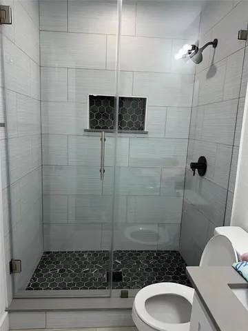 a bathroom with a toilet and a sink