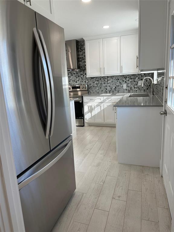 409 Hanbee Street Richardson, TX 75080 - Photo 3 of 18 a kitchen with stainless steel appliances granite countertop a refrigerator a stove a sink and a microwave