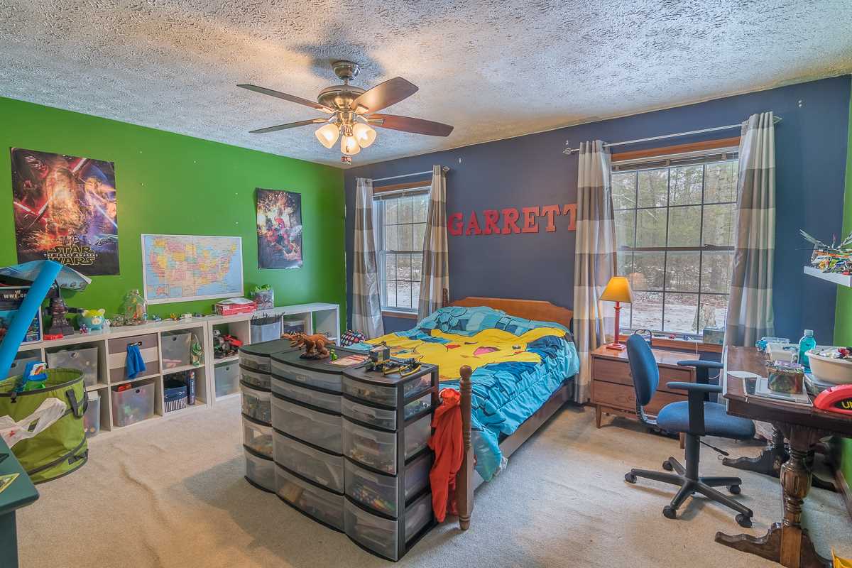 4258 Cold Springs Road Raphine, VA 24472 - Photo 30 of 50 a bedroom with furniture and a flat screen tv