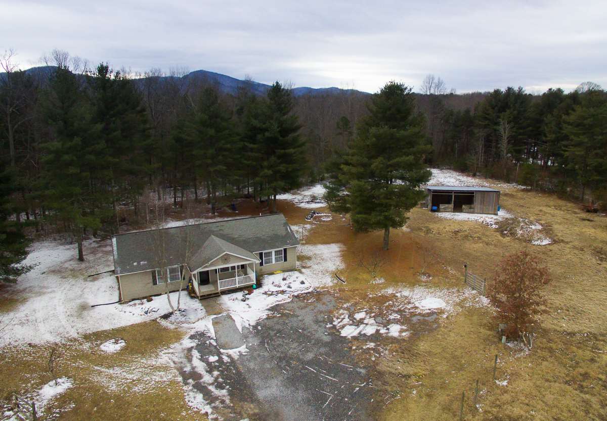 4258 Cold Springs Road Raphine, VA 24472 - Photo 3 of 50 a view of a lake with a mountain in the background