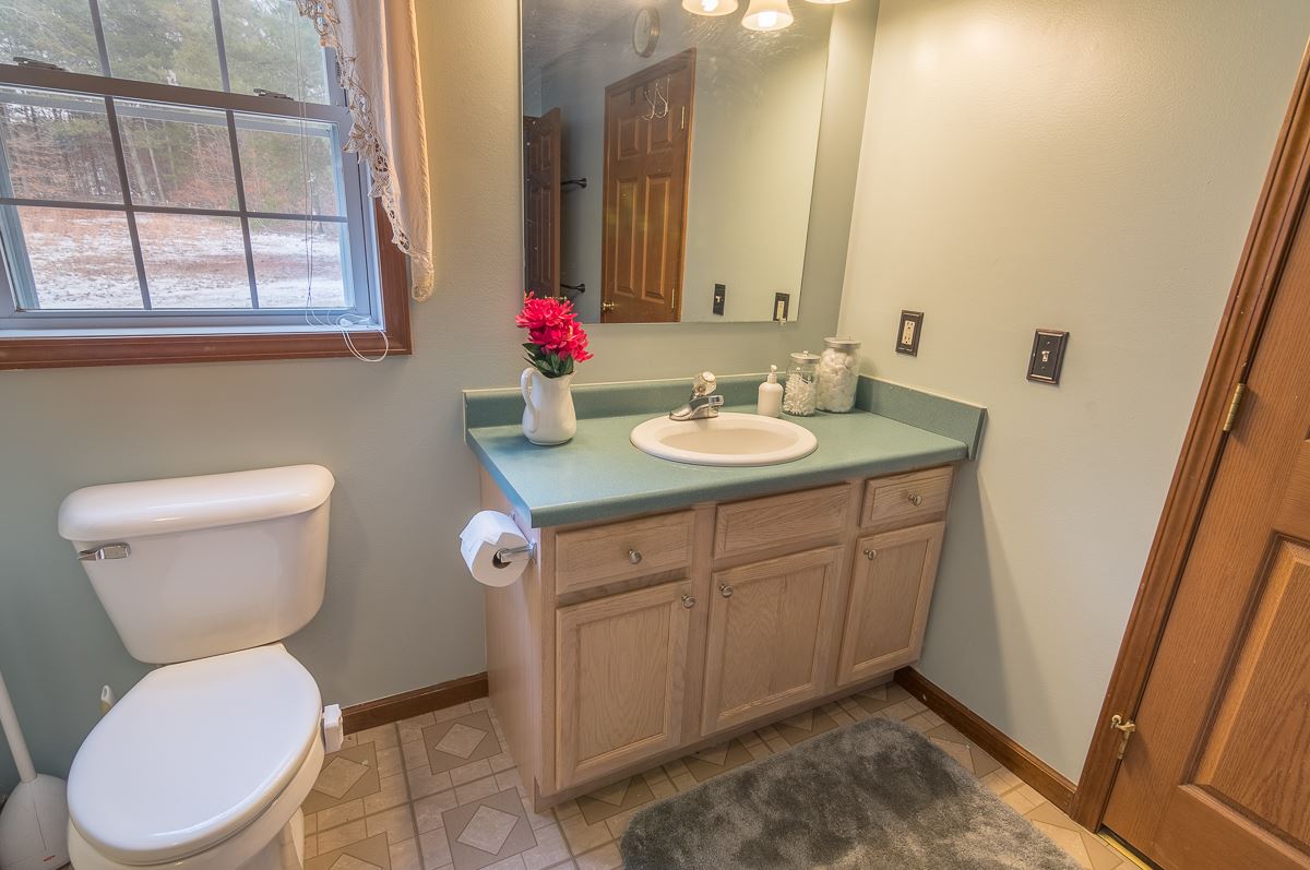4258 Cold Springs Road Raphine, VA 24472 - Photo 35 of 50 a bathroom with a toilet sink and mirror