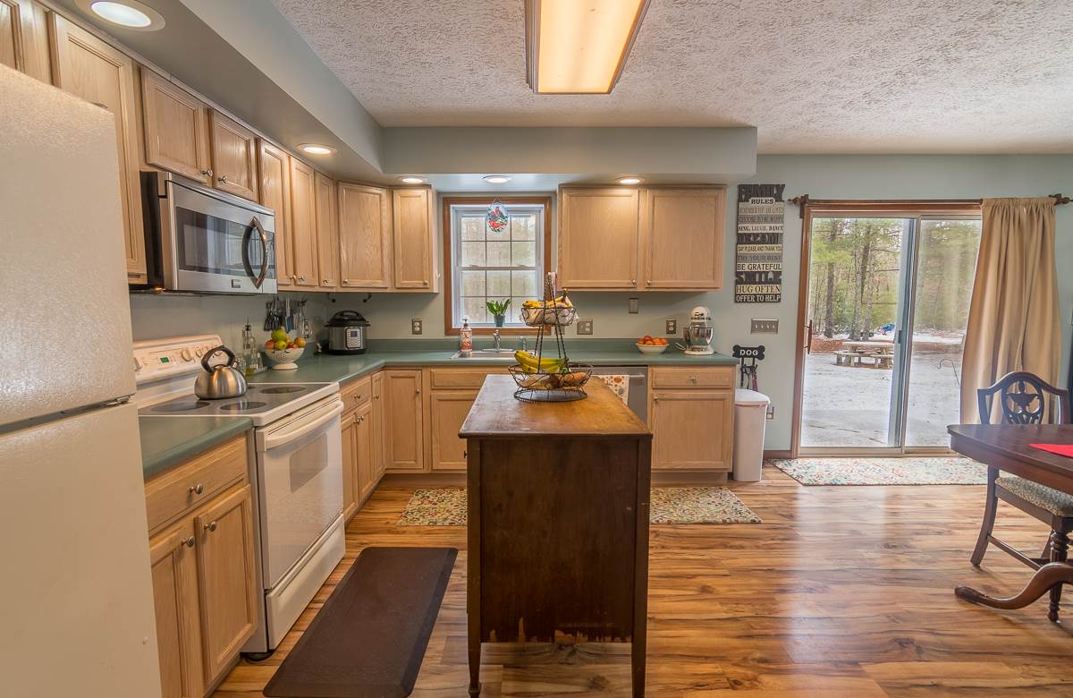 4258 Cold Springs Road Raphine, VA 24472 - Photo 9 of 50 a kitchen with stainless steel appliances granite countertop a sink a stove and a refrigerator