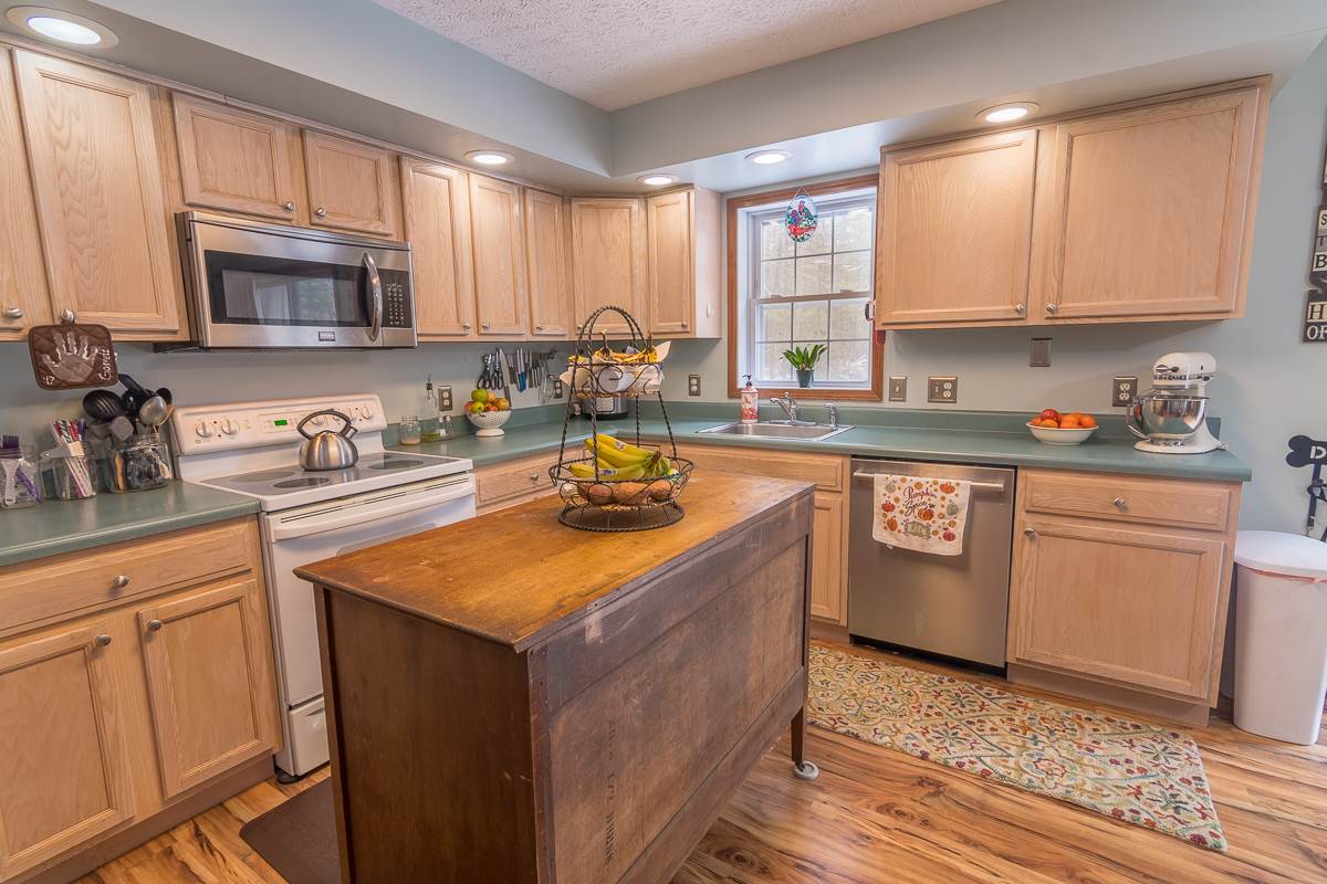 4258 Cold Springs Road Raphine, VA 24472 - Photo 10 of 50 a kitchen with stainless steel appliances granite countertop a sink stove and cabinets