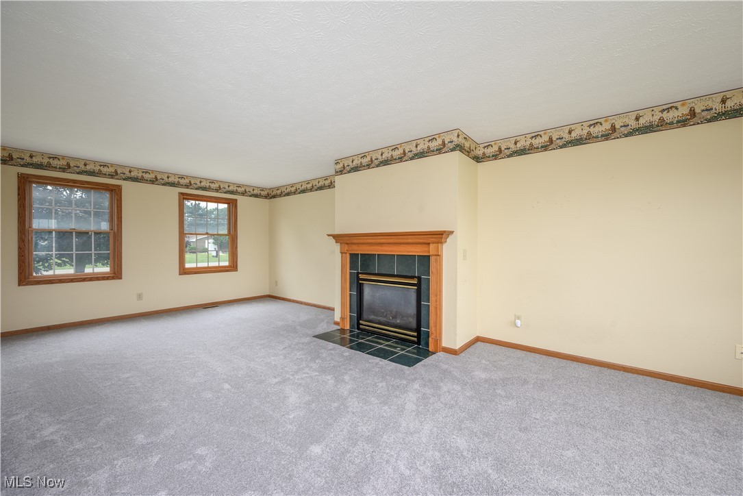 2811 Canton Road Uniontown, OH 44685 - Photo 19 of 35 Living room with gas fireplace