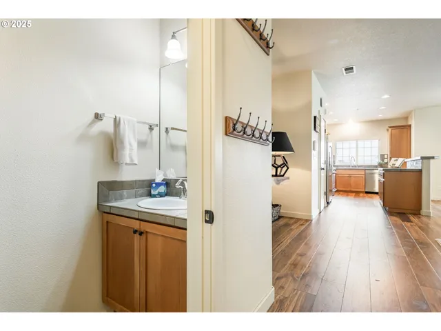 a bathroom with a sink a mirror and a shower