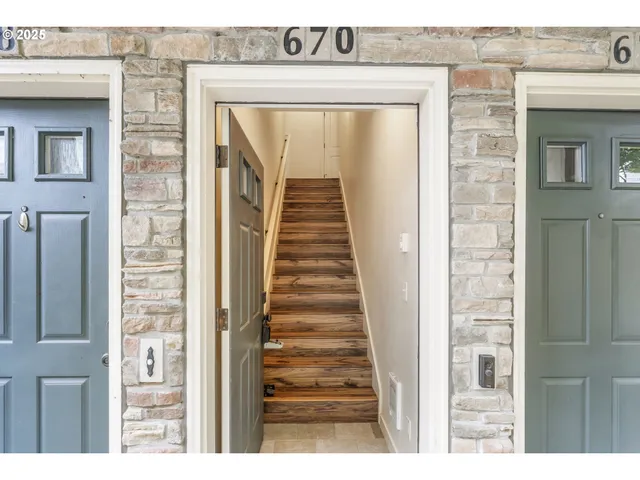 a view of a brick house with a large door