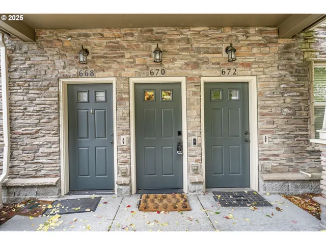 a car parked in front of a white house