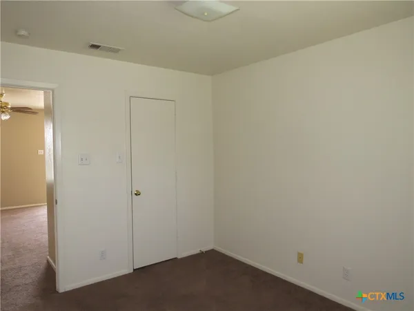 a small space with a wooden cabinets