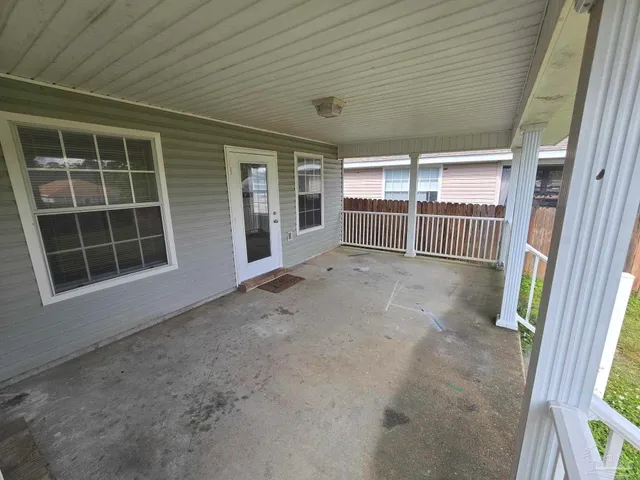 a view of a house with a small yard