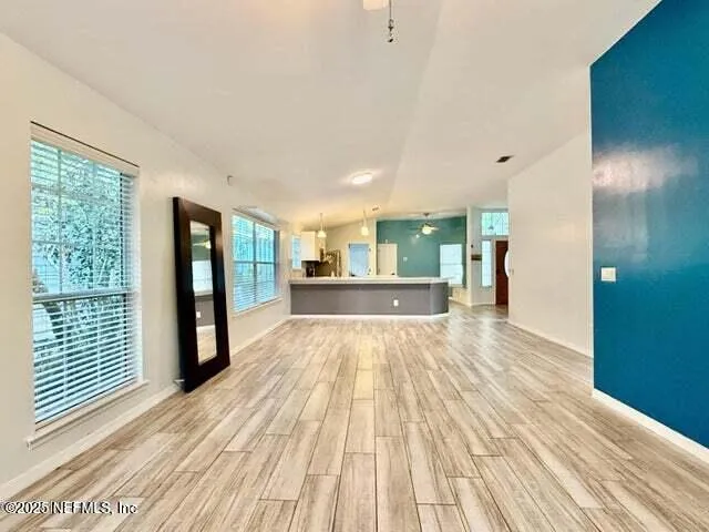 a view of an empty room with a window