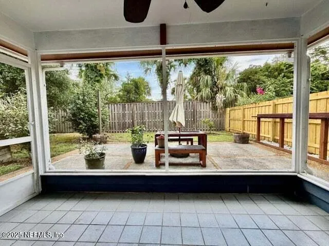 a view of a house with a yard siting area and garden