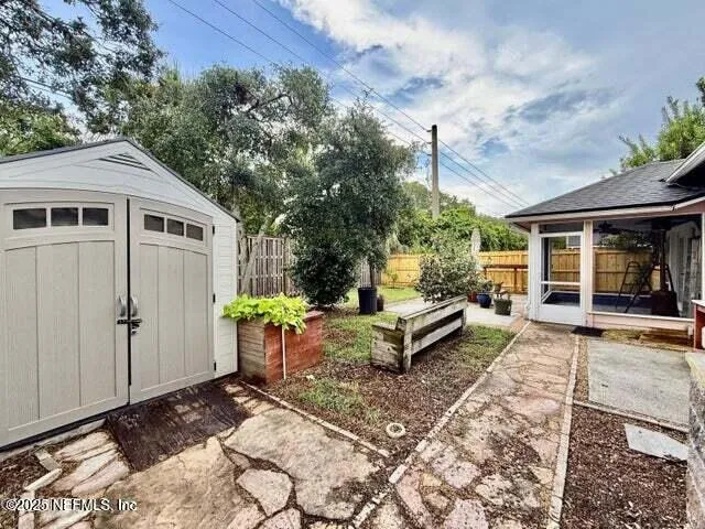 a view of a back yard with a patio
