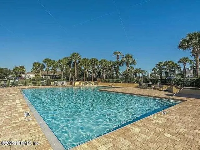 a view of swimming pool with a yard